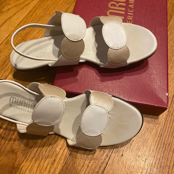 White/beige Munro low heeled sandals.